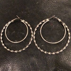 Stylish double hooped silver pierced earrings. 2.25 inches in diameter. Nice.
